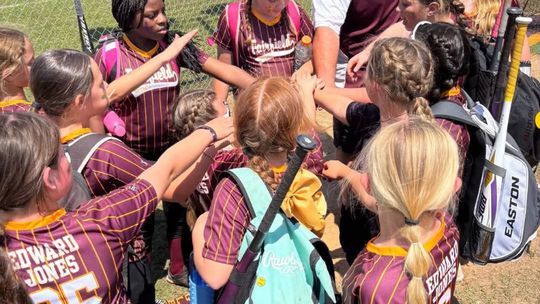 TOP: The Lady Eagles gather as a team on Saturday, April 12, during their opening day ceremony.