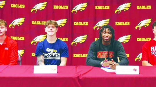 Four FHS Athletes Sign to Continue Football Career