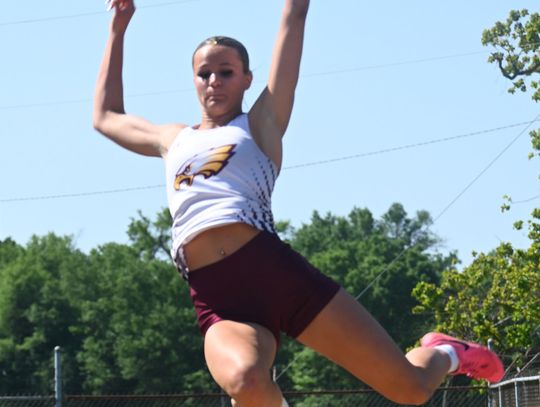Jacelynn Schmidt takes third place with a jump of 17’0” at Area to advance to Regionals. Photo by Mitchell Pate/Recorder-Chronicle