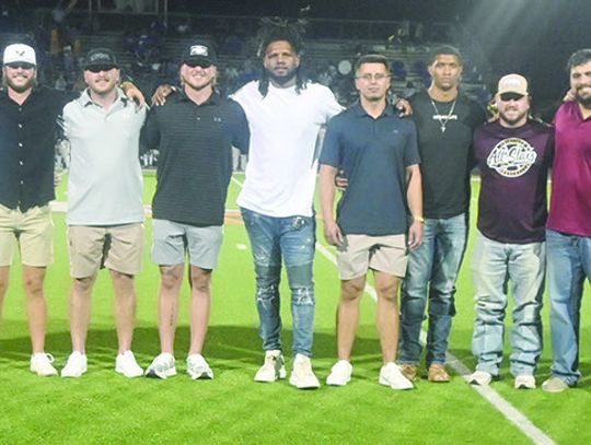 The 2013 Fairfield Eagle football team players and coaches, who competed in the state championship, were honored during halftime of the Homecoming football game on Friday night, Sept. 13. Photo by Mitchell Pate/Fairfield Recorder