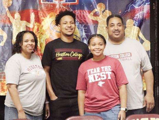 Pierre Algood signs his letter of intent to play basketball with Hesston College in Hesston, Kansas on Tuesday, April 30. Pictured are Trishana Algood, Pierre Algood, Paris Algood, and David Algood. Courtesy Photo