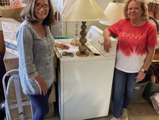 Community Club Care members Sandi DeLoach and Joy Olk check out a dryer and two of many lamps for the household part of the SuperSale. Drop-off day is April 25, and sale day is April 26. Courtesy Photo