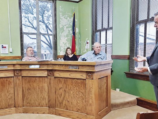 Attorney Blake Beckham explains to Freestone County Commissioners during their Dec. 4 meeting some details of a proposed opioid settlement between drug stores and the County. Photo by Roxanne Thompson/Fairfield Recorder