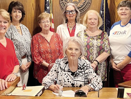 Freestone County Judge Linda Grant signs a proclamation on Friday, Sept. 13, declaring Constitution Week in Freestone County. Pictured with Judge Grant, from left, are Jonathan Hardin DAR Chapter members Diane Pullin, Andrea Richardson, Billie Bournias, Terri Patterson, Jane Morrison and B...