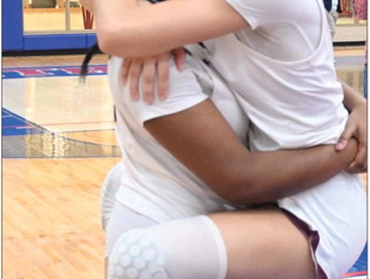 Cousins Kole and Blayke Brackens celebrate after their 61-43 victory over the Little River Academy Lady Bees in the Regional Championship on Friday night. Photo by Mitchell Pate/Fairfield Recorder