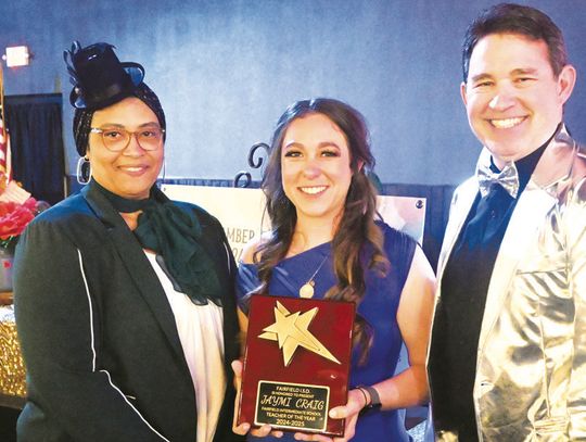 Jaymi Craig receives the Fairfield Intermediate School Teacher of the Year Award from Principal Shetonia Scires and Superintendent Joe Craig. Photo by Mitchell Pate/Fairfield Recorder