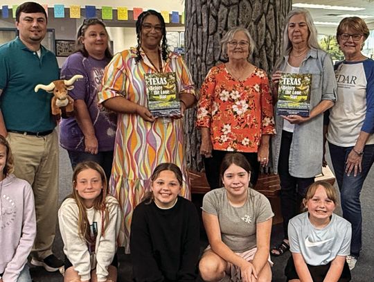 DAR donates books to FIS, TES