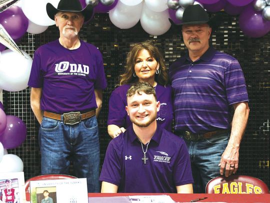 Jerry Draper signs his letter of intent to run track at the University of the Ozarks on Friday, Feb. 7. Pictured with Jerry are Jim Draper and Amy and Keith Garrett. Courtesy Photo