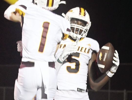Finn Smith and Kavion Hicks celebrate an Eagle touchdown on Friday night. Photo by Mitchell Pate/Fairfield Recorder