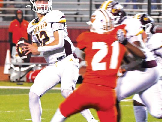 Quarterback Kohl Collins looks down the field for an open receiver on Friday night in the Bi-District Championship against Orangefield. Collins had 346 passing yards. Photo by Mitchell Pate/Fairfield Recorder