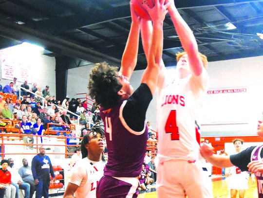 Joshua George goes up for a rebound along with Teague’s Grayson Dancer during district play on Tuesday night, Jan. 14. Photo by Mitchell Pate/Fairfield Recorder