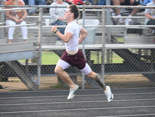 Finn Smith competes in the district track meet on Wednesday, April 2. Photo by Mitchell Pate/Recorder-Chronicle