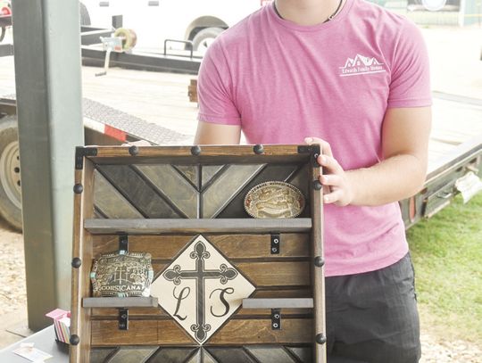 Mason Edwards shows off his custom belt buckle case at the 2024 Freestone County Ag Mechanics Show on Monday, June 10. Photo by Mitchell Pate/ Fairfield Recorder