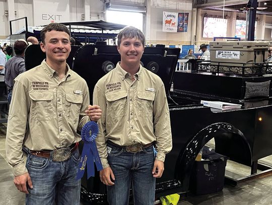 (Left, above) Adan Espinoza and Cade Nelson pose for a photo with their welding bed that they earned a blue ribbon for at the HLSR. They also earned the Division Reserve Champion. Courtesy Photo