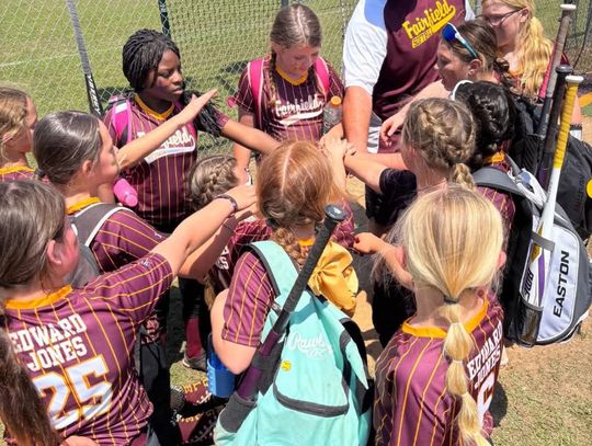 TOP: The Lady Eagles gather as a team on Saturday, April 12, during their opening day ceremony.