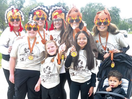 This group of friends won Best Dressed at the 2024 Flippin’ the Bird 5K on Saturday morning. Pictured, front row, from left, are Paisleiogh Solley, Amelia Solley, Daisy Caro and Alan Caro; back, Gina Martin, Andrea Lyles, Laurie Lyles, Alyssa Solley and Yesenia Caro. Photo by MItchell Pate...