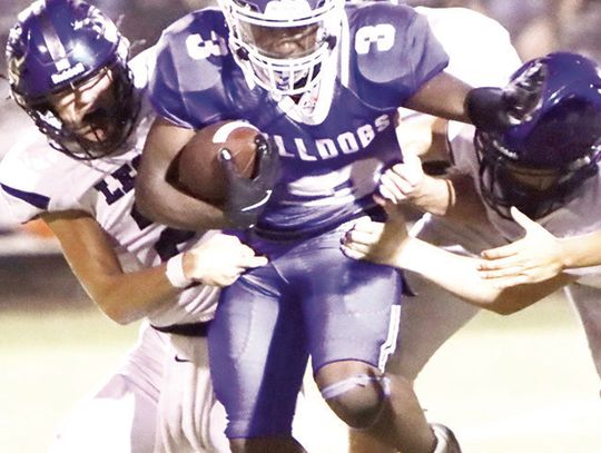 Wortham senior Kymani Johnson (3) fights off tacklers in the Bulldogs’ 20-18 victory over Leon on Friday, Sept. 13. Photo by Jennifer Lansford/For The Mexia News