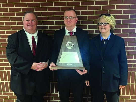 Fairfield Band Directors Gust Witt, Russell Holland, and Carla Sparks show off the Sweepstakes trophy the Grand Band from Eagle Land won at the UIL Concert and Sightreading Contest. Courtesy Photo