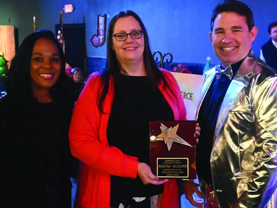 Martha Holland receives the Fairfield High School Teacher of the Year by Principal Sonya Gibson and Superintendent Joe Craig. Photo by Mitchell Pate/Fairfield Recorder