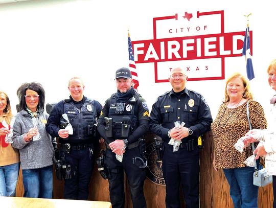 In honor of Law Enforcement Day on Thursday, Jan. 9, the Fairfield History Club representatives presented Saint Michael Police Officer coins to the Fairfield Police Department for all officers. Pictured, from left, are Doris Sneed, Lisa Baggerly, Officer Jennifer Beaver, Cpl. Jared Scarrow...
