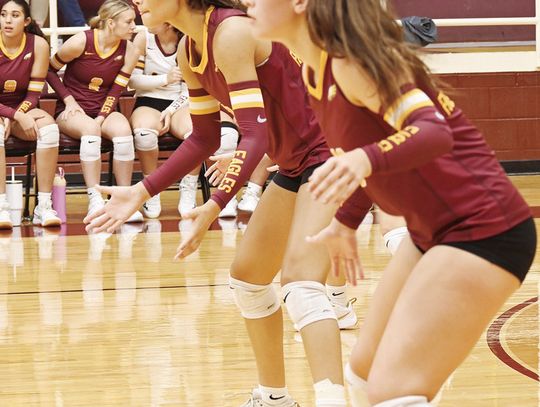 LEFT: Avery Strait and Blayke Brackens get down and ready for the ball to come their way. Photo by Mitchell Pate/ Fairfield Recorder