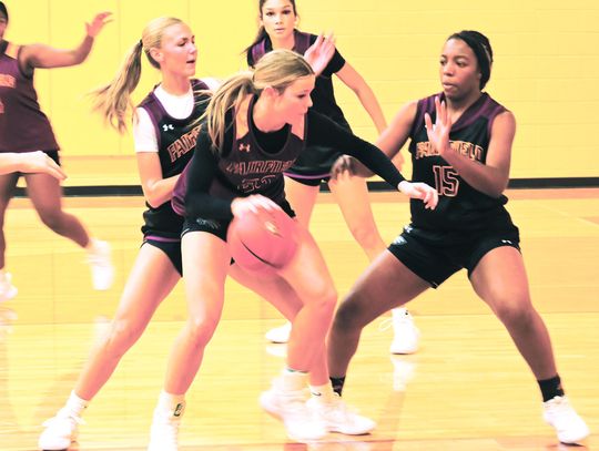 Jaclynn Schmidt dribbles the ball to the goal as Rhett Rhalstin, Jaci Abram, and Blayke Brackens play defense during practice. Photo by Mitchell Pate/Fairfield Recorder