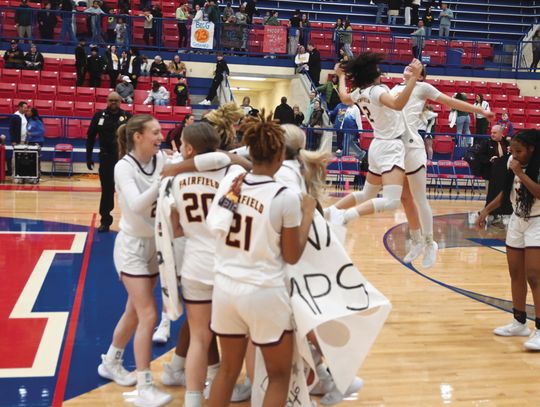 The Fairfield Lady Eagles celebrate their 61-43 victory over the Little River Academy Lady Bees in the Regional Championship. Photo by Mitchell Pate/Fairfield Recorder