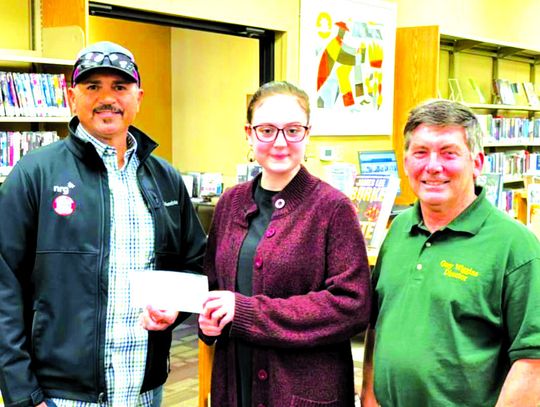 NRG Environmental supervisor Jason Scott is pictured on the left with Fairfield Library staff members Kalyn Ethridge and Gary Wiggins.