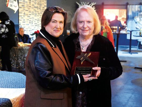Gail Farish gives the Lifetime Achievement Award to Jane Morrison. Photo by Mitchell Pate/Recorder-Chronicle