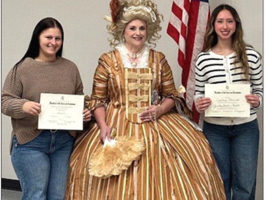 Denise Bennet of the Lady Washington Chapter of Houston poses in costume as Marquise. Adrienne de Lafayette with Brianna Latray and Constanza Alvarado. Contributed photo