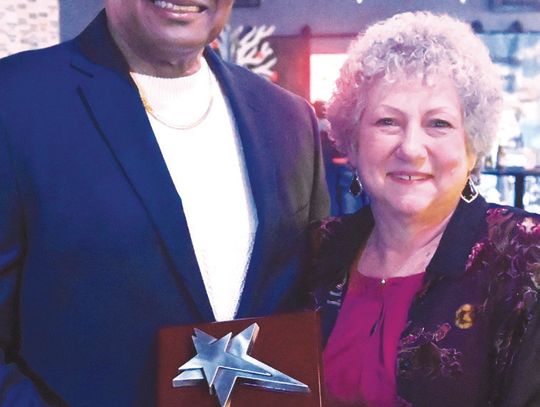 Tony Brackens Sr. receives the Legacy Award from Mary Small. Photo by Mitchell Pate/Fairfield Recorder