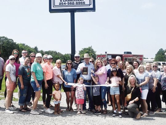 Family, friends, and community members gather on April 30 for the Grand Opening of Small Town Tees in Fairfield. Photo by Mitchell Pate/Fairfield Recorder