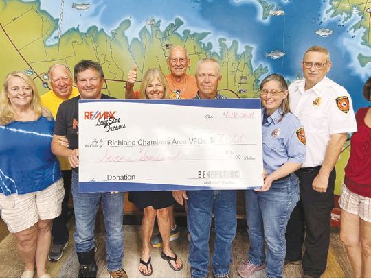 Pictured from left to right are Julie Teel, VP of Benefit RC; Bob Griffin, Board Member; John Teel, President of Benefit RC; Kay Bradshaw, Board Member; Dan Wilkie, Board Member; John Sutton, Streetman VFD; Heather Marfell, Treasurer, Streetman VFD; Matt Marfell, Assistant Chief, Streetman...
