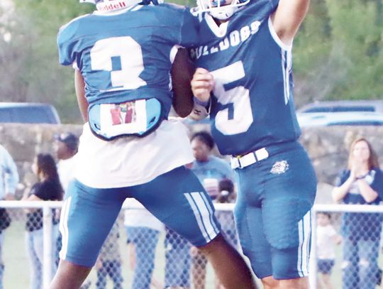 Wortham’s Kymani Johnson (3) and Jon Ross Black celebrate during the club’s 48-20 over rival Frost.