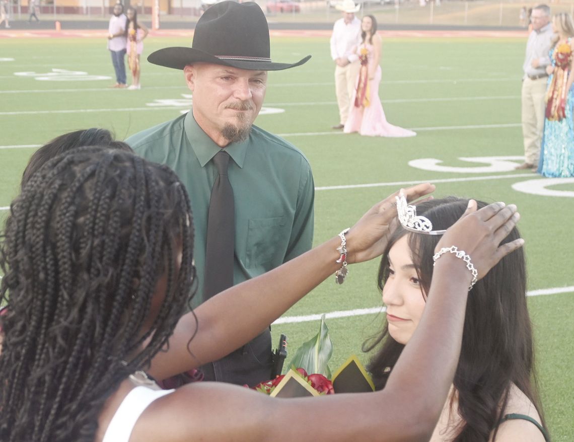 Senior Angelina Cobb is crowned the 2024 Fairfield High School Homecoming Queen by 2023 FHS Homecoming Queen Charlee Brackens, as Cobb’s father, Paul, looks on prior to the football game against Brownsboro on Friday night, Sept. 13. Photo by Mitchell Pate/Fairfield Recorder