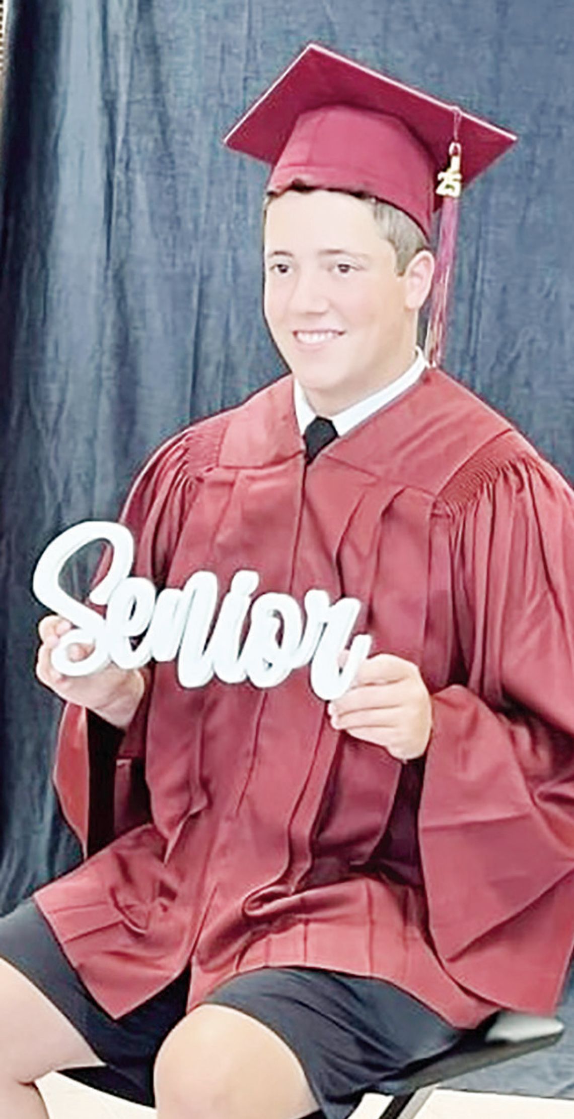 Connor Petty, a senior at Fairfield High School, takes his senior cap and gown pictures at Fairfield High School on Thursday, Aug. 1. Connor has attended FISD since first grade. He is the son of Tommy and Rachel Petty.
