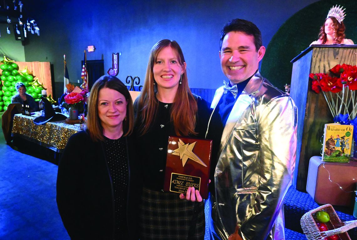 Aimee Burks is recognized as the Fairfield Junior High Teacher of the Year by Principal Cari Martin and Superintendent Joe Craig. Photo by Mitchell Pate/Fairfield Recorder