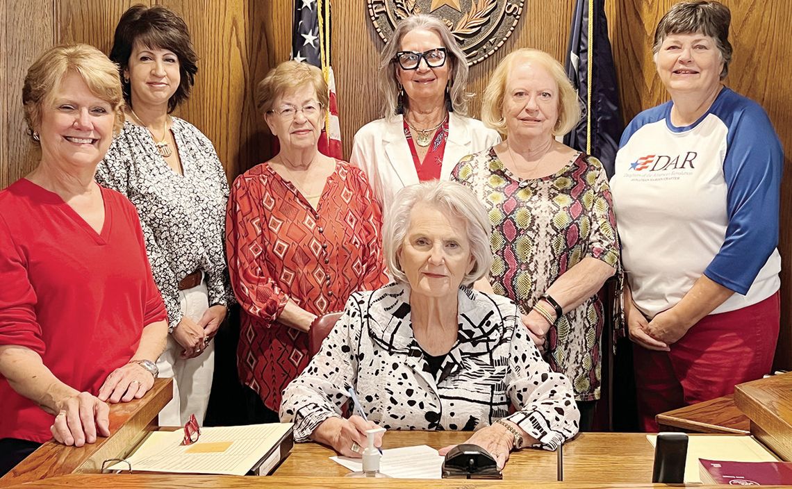 Freestone County Judge Linda Grant signs a proclamation on Friday, Sept. 13, declaring Constitution Week in Freestone County. Pictured with Judge Grant, from left, are Jonathan Hardin DAR Chapter members Diane Pullin, Andrea Richardson, Billie Bournias, Terri Patterson, Jane Morrison and B...