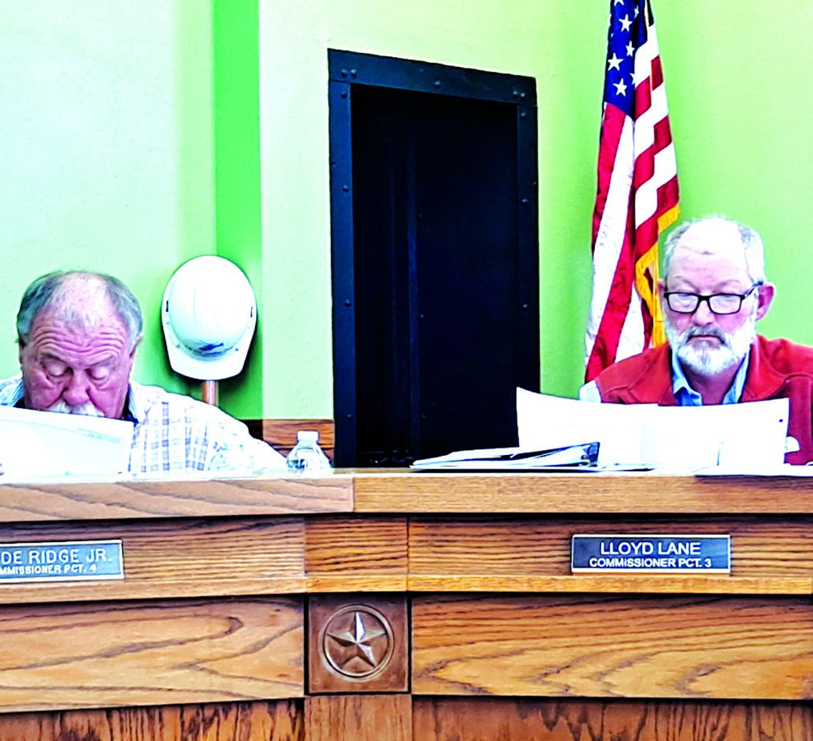 Freestone County Commissioners study the election results as they canvass the votes from the Nov. 5 General Election at their Nov. 18 meeting. Photos by Roxanne Thompson/Special to The Mexia News