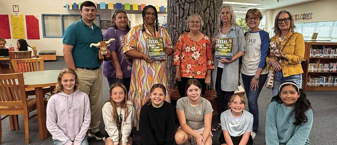 DAR donates books to FIS, TES