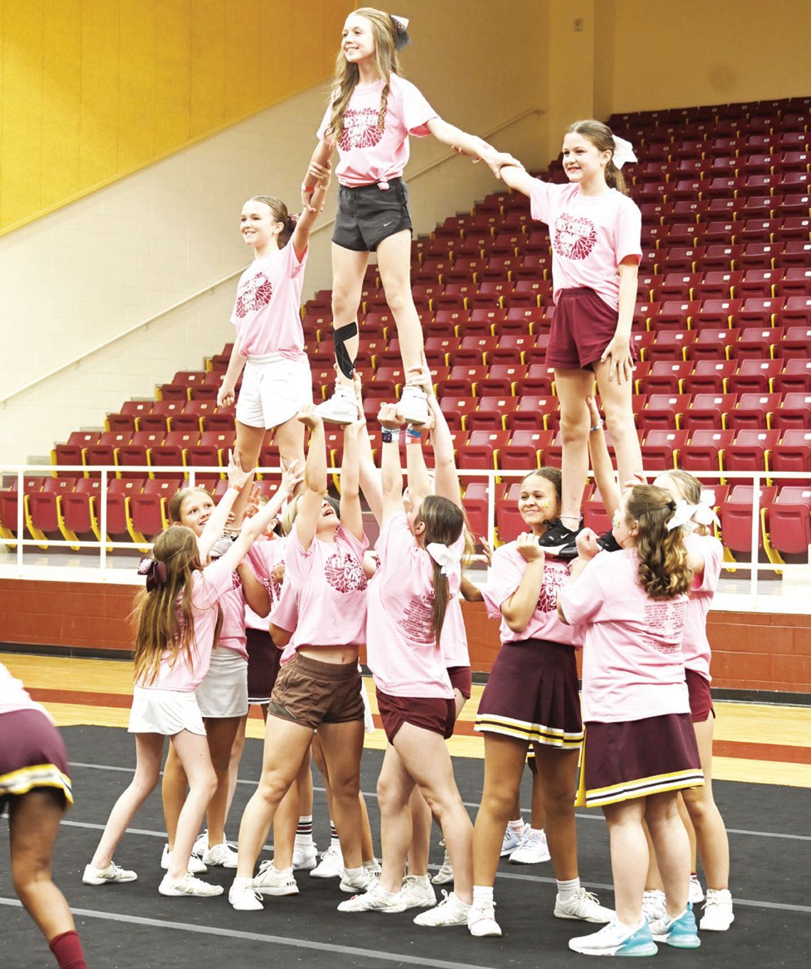 Youngsters perform during a pep rally at the end of cheer camp last week.