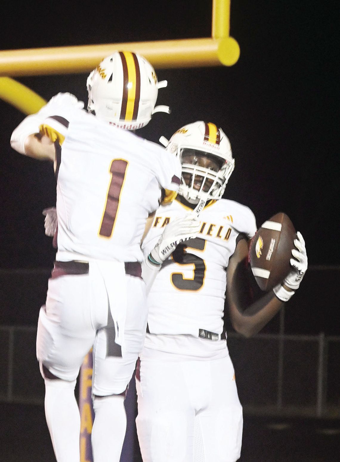 Finn Smith and Kavion Hicks celebrate an Eagle touchdown on Friday night. Photo by Mitchell Pate/Fairfield Recorder