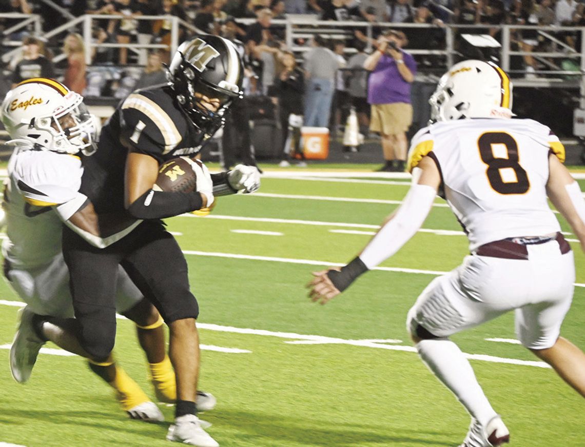 Davonte Alexander tackles a McGregor ball carrier on Friday night in the Eagles 69-40 win over the Bulldogs.