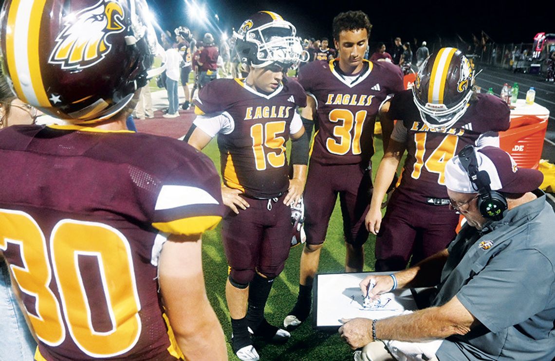 Fairfield Coach Kevin Childers coaches some players during the game against Mexia on Friday night. Photo by Mitchell Pate/Fairfield Recorder