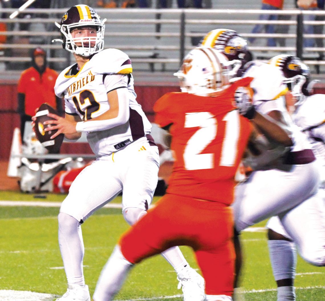 Quarterback Kohl Collins looks down the field for an open receiver on Friday night in the Bi-District Championship against Orangefield. Collins had 346 passing yards. Photo by Mitchell Pate/Fairfield Recorder