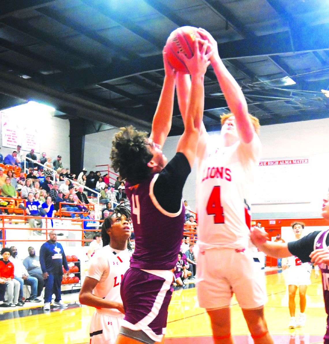 Joshua George goes up for a rebound along with Teague’s Grayson Dancer during district play on Tuesday night, Jan. 14. Photo by Mitchell Pate/Fairfield Recorder