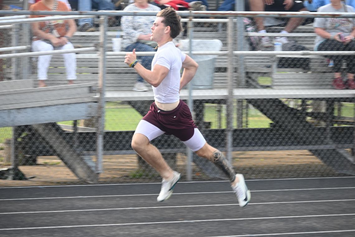 Finn Smith competes in the district track meet on Wednesday, April 2. Photo by Mitchell Pate/Recorder-Chronicle