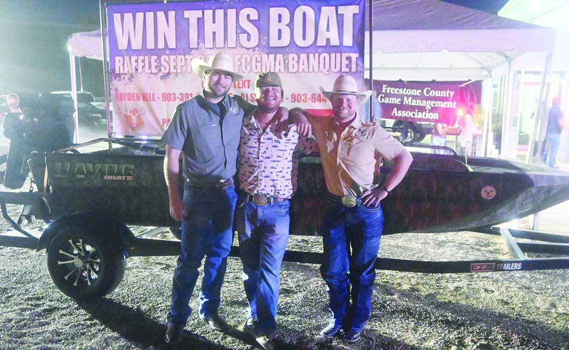 Garrett Dawson is all smiles after winning the boat raffled off at the 2024 Freestone County Game Management Association Banquet on Saturday night. Pictured are Hayden Hill, Garrett Dawson, and Cole Turner. Photo by Mitchell Pate/Fairfield Recorder