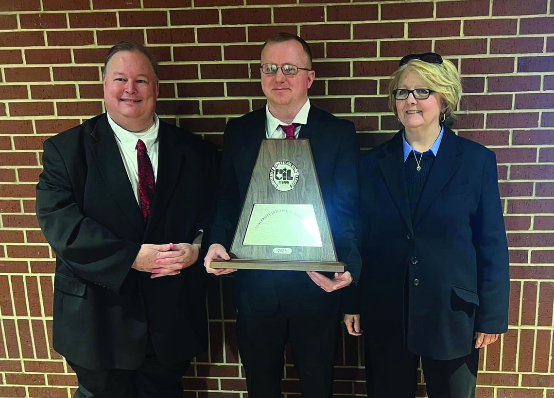 Fairfield Band Directors Gust Witt, Russell Holland, and Carla Sparks show off the Sweepstakes trophy the Grand Band from Eagle Land won at the UIL Concert and Sightreading Contest. Courtesy Photo