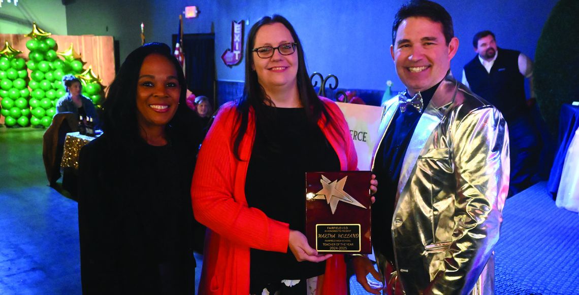 Martha Holland receives the Fairfield High School Teacher of the Year by Principal Sonya Gibson and Superintendent Joe Craig. Photo by Mitchell Pate/Fairfield Recorder